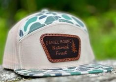 Daniel Boone National Forest leather patch on LOST HAT CO. 7 panel or Richardson 168 hat. Leather patch will be sewn on the hat!  Made to order. Choose your own color!  We use authentic leather only! Thank you for supporting our small business! Outdoor Trucker Hat With Leather Patch And Short Brim, Outdoor Short Brim Hats With Logo Patch, Outdoor 5-panel Baseball Cap With Leather Patch, Brown 5-panel Adventure Hat, Casual Leather Six-panel Snapback Hat, Outdoor Cap With Letter Patch, Outdoor Brown Baseball Cap With Letter Patch, Outdoor Hats With Letter Patch And Curved Brim, Leather Patch Trucker Hat 5-panel