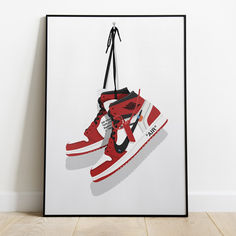 a red and white sneaker poster hanging on a wall