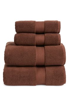 six brown towels stacked on top of each other