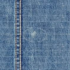 close up view of blue jean fabric with stitching