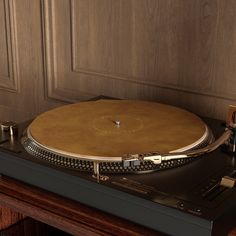 a turntable sitting on top of a wooden table