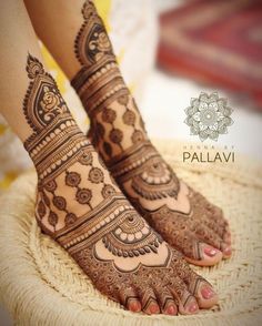 the feet are decorated with henna designs