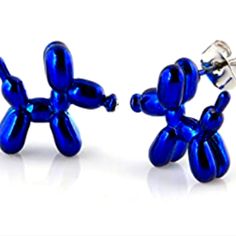 blue balloon man cufflinks are shown in front of a white background with reflections