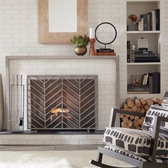 a living room with a fire place and bookshelves