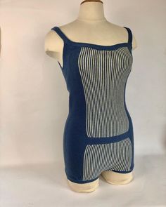 a female mannequin wearing a blue and white striped bodysuit