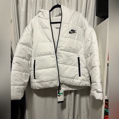 Brand New , White Nike Therma-Fit Puffer Jacket Very Stylish Perfect For The Weather White Hooded Jacket For Outdoor Activities In Spring, White Hooded Jacket For Outdoor Spring Activities, White Hooded Jacket For Spring Outdoor Activities, Sporty Long Sleeve Quilted Jacket For Outdoor, White Puffer Quilted Jacket For Winter, White Quilted Puffer Jacket For Winter, Functional White Long-sleeved Hooded Jacket, Nike White Functional Hooded Jacket, Nike Functional Puffer Jacket For Cold Weather