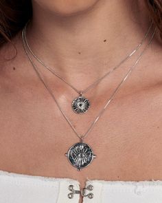 Our best-selling double coin charm necklace with embossed evil eye design Sold as a set of 2 necklaces- Necklaces are NOT connected and can be worn separately Chains are 16" and 18", both with 2" of extender chain Smaller charm is 0.65" (16.6 mm) Larger charm is 0.92" (23.5mm) Made From Brass with Swarovski Crystals Plating is 0.03 microns + e-coating for long lasting durability Plated high polish Rhodium for maximum shine Both chains have a lobster clasp closure Necklace is 100% nickel-free and Silver Tarnish Resistant Charm Necklace For Layering, Silver Tarnish-resistant Charm Necklace For Layering, Silver Coin Pendant Necklace For Layering, Silver Necklace With Coin Pendant For Layering, Silver Coin Necklace For Layering, Silver Coin Pendant Jewelry For Layering, Silver Tarnish Resistant Round Disc Charm Necklace, Silver Tarnish Resistant Round Disc Coin Necklace, Silver Tarnish Resistant Coin Necklace