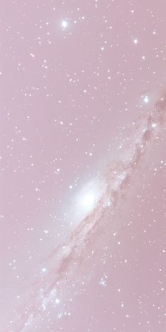 the sky is filled with white stars and pink hues, as if it were from outer space