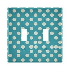 a blue and white polka dot light switch plate