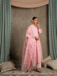 Set of 3 consists of kurta, dupatta and salwar KURTA- Floral hand printed Ghera gathered kurta with flared sleeves, hand made button and scallop detailing. Salwar- Printed salwar with scalloped hem with gold kiran detailing. Dupatta- handwoven kota block printed dupatta. Colour - Pink Fabric - Cotton and Kota Doria Occasion - Festive Wear / Occasion Wear Fit - Relaxed and flowy Pattern - Printed Care - Dry Clean only Estimated Delivery 15-20 days Available in other Colors Inaayat- These are fini Long Sleeve Mulmul Kurta With Sheer Dupatta, Wedding Lawn Suit With Block Print, Chanderi Block Print Lawn Suit For Wedding, Block Print Salwar Kameez With Straight Kurta For Wedding, Wedding Straight Kurta With Block Print, Unstitched Suit With Block Print For Wedding, Traditional Pink Lawn Suit With Block Print, Wedding Salwar Kameez In Pink With Block Print, Anarkali Unstitched Wedding Suit With Block Print