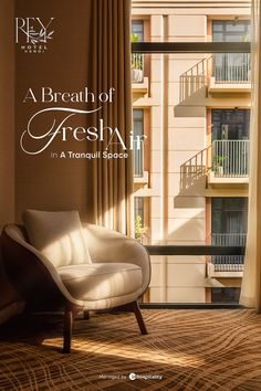 a white chair sitting in front of a window next to a brown and tan wall