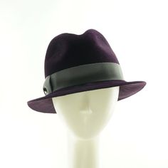 "Classic purple fedora hat for women, hand sewn and expertly crafted using authentic vintage tools and techniques.  The care involved in the loving construction of this ladies winter hat ensures long lasting beauty, style, color and fit.  Couture quality and a genuine vintage hat style in an eggplant purple color that is utterly spectacular. *  size 22 - fits average size heads *  luxurious fur felt, velour finish *  charcoal gray grosgrain hat band, bow and knot This fedora hat has a versatile \"snap brim\", you can wear it with the brim up in front and down in back or vice versa.  Or you can have both sides up or both sides down. Find your favorite look easily. An elegant, wearable handmade hat that can be paired casually with any outfit , or can accent just about anything you own.  Wear Vintage Hat Styles, Womens Felt Hat, Womens Winter Hat, 1950s Hat, Finding A Hobby, Hat Fedora, Hobbies For Women, Hat Blocks, Fedora Hat Women