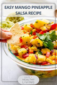 a bowl filled with pineapple salsa and tortilla chips