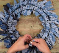 someone is making a wreath out of old jeans