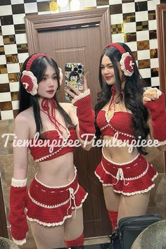 two women dressed in red and white outfits taking a selfie with their cell phone