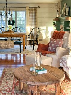 a living room filled with furniture and a fire place