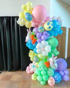 there are many balloons in the shape of animals