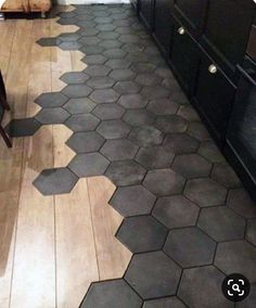 a kitchen floor with hexagonal tiles on it