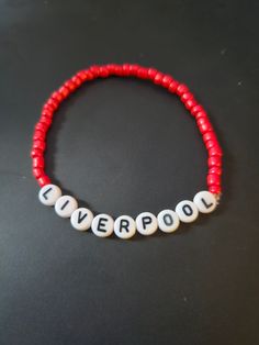 Liverpool Beeded Bracelet. Themed Avaliable in multiple colors, size. Customized White Novelty Bracelets, Red Novelty Beaded Bracelets For Friendship, Customized White Novelty Bracelet, Personalized Red Novelty Bracelets, Customized Adjustable Red Wristband, Novelty Letter Beads Wristband Bracelet, Customized Red Wristband For Friendship, Customized Red Casual Jewelry, Customized Casual Red Jewelry