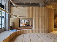 an empty room with wooden slats on the walls