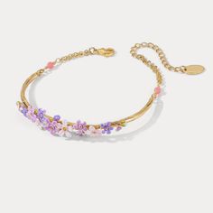 The aura of romance that surrounds forget-me-not flowers makes these bracelets special gifts for women at any occasion. Taking on timeless design, these flower bracelets go with any outfits. Dipped in 18K gold and sophisticatedly enamelled, these bracelets look elegant and luxurious around your wrist. DETAILS Plating: 18K Gold Materials: 18K Gold on Brass, Enamel Measurements: Length: 8.67" (22cm) + Extender: 1.97" (5.0cm) Weight: 7.3 g Hypoallergenic design Dainty Flower-shaped Crystal Bracelet, Flower Shaped Crystal Bracelet Gift, Elegant Flower Crystal Bracelet For Spring, Elegant Flower Shaped Crystal Bracelet For Spring, Elegant Beaded Bracelets For Spring Gift, Elegant Spring Bracelet With Flower Charm, Elegant Adjustable Crystal Bracelet For Spring, Spring Wedding Bangle Bracelets, Elegant Spring Bracelets In Flower Shape