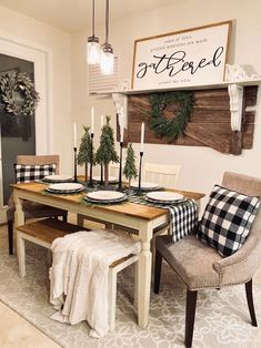 the dining room table is set for christmas dinner