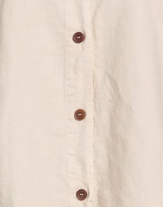 Elevate your wardrobe with the timeless sophistication of our Linen Shirt. Crafted in Italy with a blend of 51% linen and 49% cotton, this shirt is the epitome of quality and design creativity. Its long sleeves and button closing add a touch of versatility, while the solid color and classic neckline exude a sense of understated elegance. Perfect for both casual and formal occasions, this shirt seamlessly transitions from day to night with ease. The breathable fabric ensures all-day comfort, making it an ideal choice for those warm summer days or tropical getaways. Its classic silhouette offers a flattering fit for any body type, and the premium materials ensure long-lasting durability. Whether you're strolling along the beach or attending a business meeting, the Linen Shirt is a versatile Solid Winter Shirt With Buttons, Beige Long Sleeve Button Shirt, Winter Cotton Blouse With Button Closure, Winter Cotton Blouse With Buttons, Cream Cotton Shirt With Buttons, Beige Collared Shirt With Button Closure, Beige Shirt With Button Cuffs For Fall, Fall Daywear Shirt With Covered Buttons, Fall Shirt With Covered Buttons For Daywear