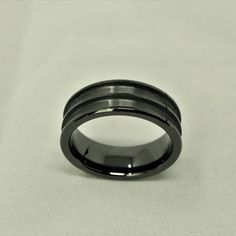 Black Ceramic Double Channel Ring Blank 8mm Wide 2.5mm Channels Product Information: Material: CeramicColor: BlackWidth: 8mmChannel: 2.5mm Double ChannelStyle: One Piece DesignComfort Fit: YesSizing: US 7-13.5 Benefit Of Using Our Blanks/Cores? Our ring blanks are polished on the inside of the ring this gives the ring a finished and perfected look. It also makes the ring more comfortable when wearing and taking on and off your finger. Our ring cores are brushed within the channel of the ring. Th Modern Black Round Rings, Modern Black Promise Ring, Modern Black Round Band Ring, Minimalist Black Round Band Ring, Modern Black Adjustable Rings, Minimalist Black Round Ring, Channel Ring, Lavender Opal, Ring Blanks