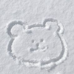 an animal drawn in the snow with it's head sticking out from the snow