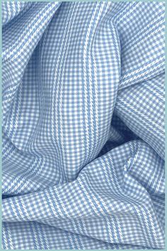 the blue and white checkered fabric has been folded up to show it's folds