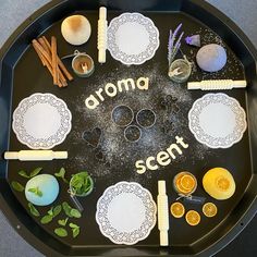 an arrangement of food arranged in the shape of a circle on a black platter