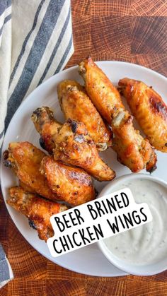 beer brined chicken wings on a plate with ranch dressing