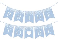 the bride to be banner is blue and white