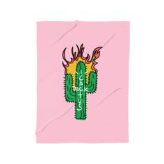 a pink blanket with a green cactus on the front and yellow flames on the back