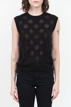 The Mael Shell is a sleeveless knit tank top, featuring a delicate polka dot pattern. Made from a blend of tencel and cashmere, this top offers a soft and semi-sheer texture that exudes luxury. Perfect for layering or wearing on its own, this black tank top with sheer circles is a unique piece that will effortlessly elevate any outfit. Sheer Texture, Tassel Scarf, Sleeveless Knit, Knit Tank Top, Black Tank Top, Rachel Comey, Knit Tank, Polka Dot Pattern, Knit Tees