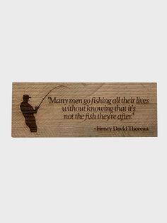 a wooden plaque with a fishing quote on the front and back of it that says,'many men go fishing all their lives without engaging that it's not the fish they give