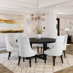 a black and white dining room table surrounded by white chairs with an area rug on the floor