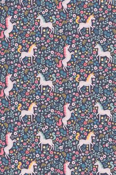 a pattern with unicorns and flowers on a blue background