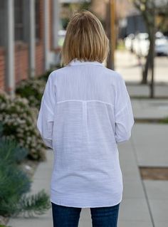 Take a look at out beautiful White Textured Fabric Long Sleeve Shirt Soft washed textured fabric Color: White Fabric content: 60% Cotton, 40% Modal Semi loose body with sides slightly shorter than front and back Shirt collar and front placket with small wood buttons in the front Has one chest pocket Long sleeves with cuffs and one small button Back yoke with one pleat Center back length 28" Hand wash or dry clean Layering Cotton Tops With Placket, Cotton Blouse With Shirttail Hem For Day Out, Casual Spread Collar Blouse For Day Out, Beach Cotton Tops With Collared Neckline, Casual Blouse With Spread Collar For Day Out, Shirttail Hem Tops With Placket For Day Out, Blouse With Shirttail Hem And Placket For Day Out, Oversized Casual Blouse With Collared Neckline, Casual Collared Blouse For Layering