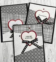 four handmade cards with hearts on them, one is black and the other is white