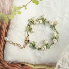 Lily Of The Valley Bracelet is a delicate nature jewelry on sale in Selenichast online shop. If you need a flower bracelet, this is the best choice. You will own a piece of fine jewelry. ﻿Inspired by the flowers of lily of the valley symbolizing good wishes and happiness, these little bell-shaped flowers earrings which grow in clusters are meant to be a good choose to give this exquisite Earrings to someone you love to wish them good luck and prosperity. The Lily Of The Valley Bracelet is made Lily Of The Valley Fairy, Textiles Book, Bracelet Gift Ideas, Lily Bracelet, Sussex Wedding, Fairy Witch, Born In May, Flowers Earrings, Valley Flowers