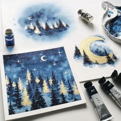 watercolors and ink are being used to paint the night sky with pine trees