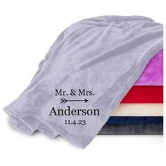 two personalized towels are stacked on top of each other