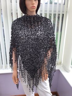 "This glamorous black shawl is so very smart, with its sparkly silver glitz threads, a sure winner for a party, smart event, black tie do, or a special occasion of any kind. A really lovely, unique gift for any fashionista, too! It really is something special for any lady, & a bespoke accessory at an affordable price. A superb item to wear. 95% polyester, 5% metallic lurex Hand wash, or machine wash on gentle. Dry flat or gentle tumble dry. Approx size- from top to point, 61cm (24\") x 164cm (64\") across, at its widest point I have been established for several years, & have won awards for my scarves, as they are so versatile & easy to wear, as are the shawls, which have evolved as a result of customer requests, & are proving to be equally as popular. I have also been interviewed on local Elegant Winter Party Shawl, Silver Formal Shawl, Black Winter Shawl Wrap, Black Shawl Wrap For Winter, Elegant Black Evening Shawl, Black Winter Evening Shawl, Black Evening Shawl For Winter, Lady A, Black Shawl