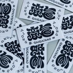 black and white stickers with the words gaugiah written in chinese on them