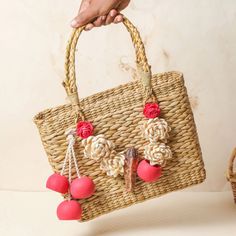 "This adorable handmade from dry grass handbag is sure to steal your heart. This bag is carefully patterned to provide a superior quality build to it. Make a bold style statement with this trendy bag. It can be paired with both traditional and western attires alike. It has ample space to carry your daily essentials. Not only a healthy alternative to plastic, but this bag is also eco-friendly and elegant. This is a light in weight, 100% handmade product, making it authentically unique to itself. Handmade Flower-shaped Bag For Vacation, Handmade Flower Shoulder Bag For Beach, Summer Bags With Bamboo Handle, Eco-friendly Straw Beach Bag As Gift, Eco-friendly Straw Beach Bag Gift, Natural Straw Bag With Bamboo Handle As Gift, Handmade Straw Shoulder Bag As Gift, Handmade Straw Shoulder Bag For Gift, French Market Basket