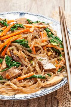 stir fry with beef, carrots and spinach on a plate