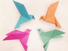 four origami birds arranged in a circle