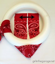 a red bandana and white ring with an arrow on it