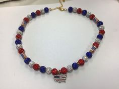 Red,white,and blue beads with Silver pendant Red Patriotic Necklace For 4th Of July, Patriotic Round Beads Necklace As Gift, Patriotic Round Beads Necklace Gift, Patriotic Blue Jewelry With Colorful Beads, Patriotic Blue Beaded Necklaces, Patriotic Blue Beaded Necklace, Patriotic Multicolor Necklaces For Gifts, Patriotic Blue Beaded Necklace For Gifts, Blue Patriotic Necklace For Gift